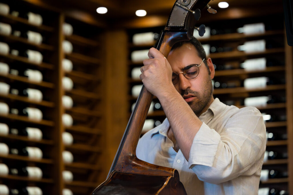 Bassist Luca Alemanno at Urban Press Winery, playing with Julie Kelly. June 4, 2023.